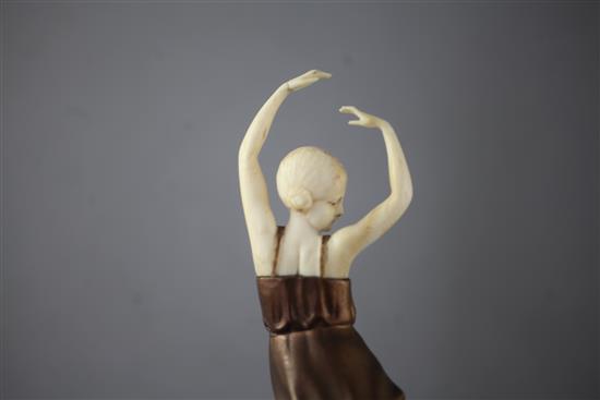 An Art Deco ivory and cold patinated bronze figure of a dancing girl, height 7in.